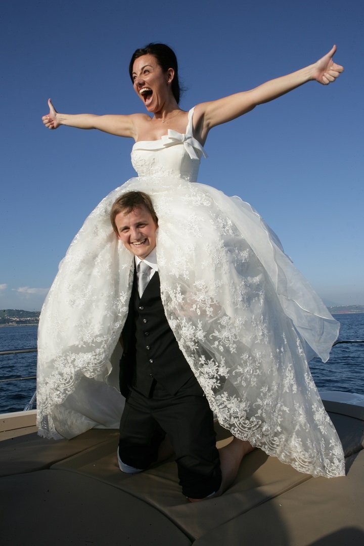 Mariacristina and George on a boat on their wedding day