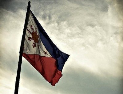 Philippines flag in grey sky