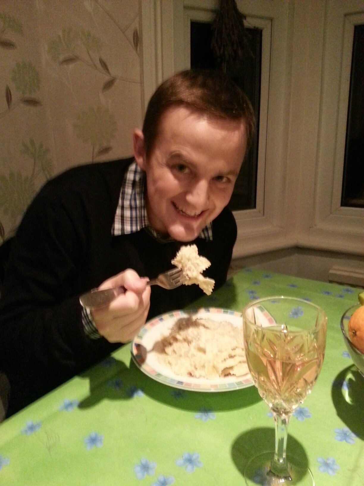 George eating pasta at home