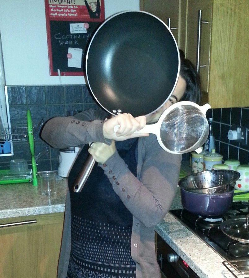 Mariacristina wielding kitchen tools