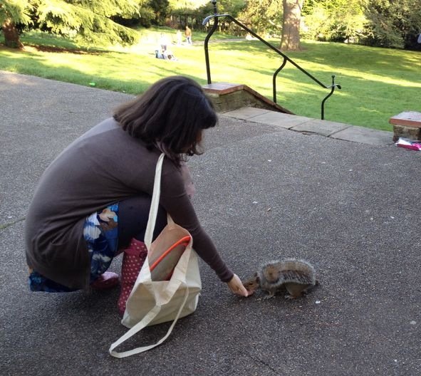 Mariacristina feeding a squirrel