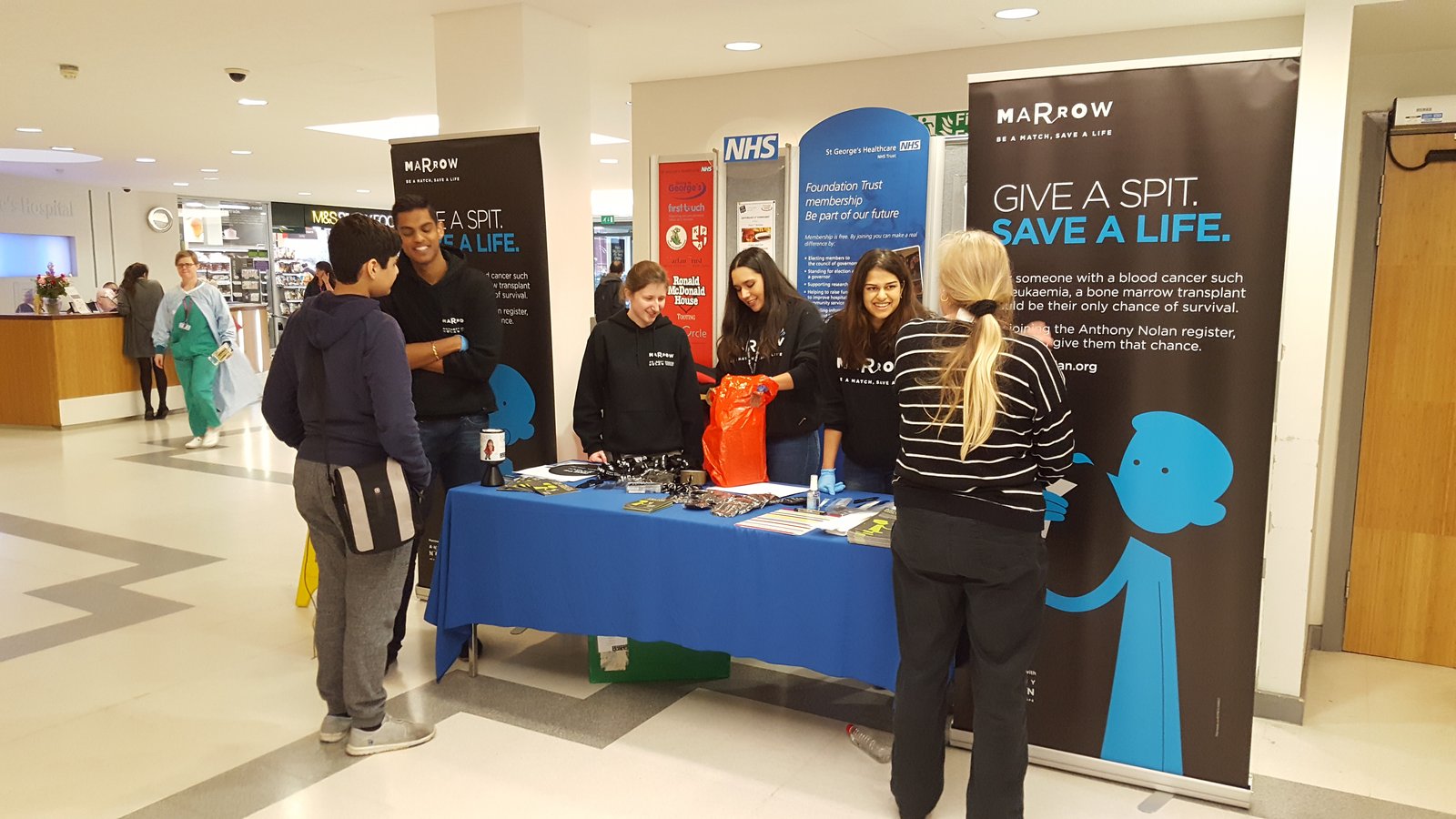 Students advertising Anthony Nolan's 'Give a spit' campaign at St George's hospital