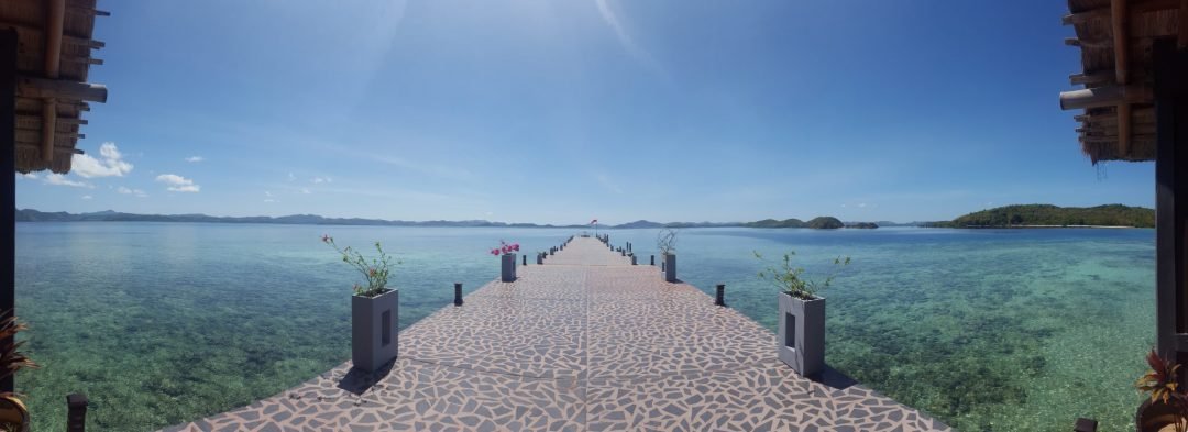 Panorama of jetty and turquoise sea from Huma Island reception in the Philippines